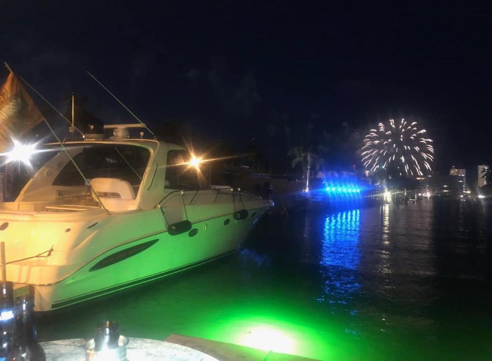 Yacht charter in Boca Raton during daytime and evening, showcasing the unique experiences of both options